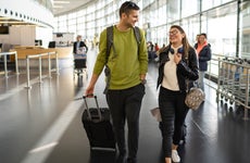 couple walking through airport