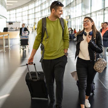 couple walking through airport