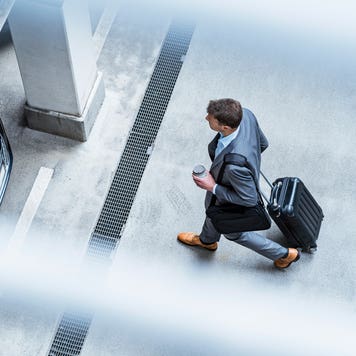 business man walking to car