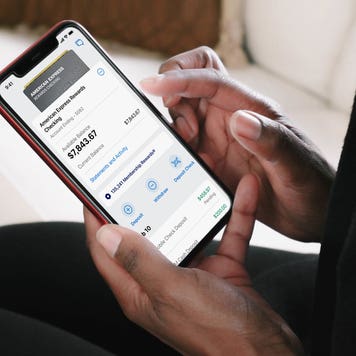 person looking at american express digital checking account on phone