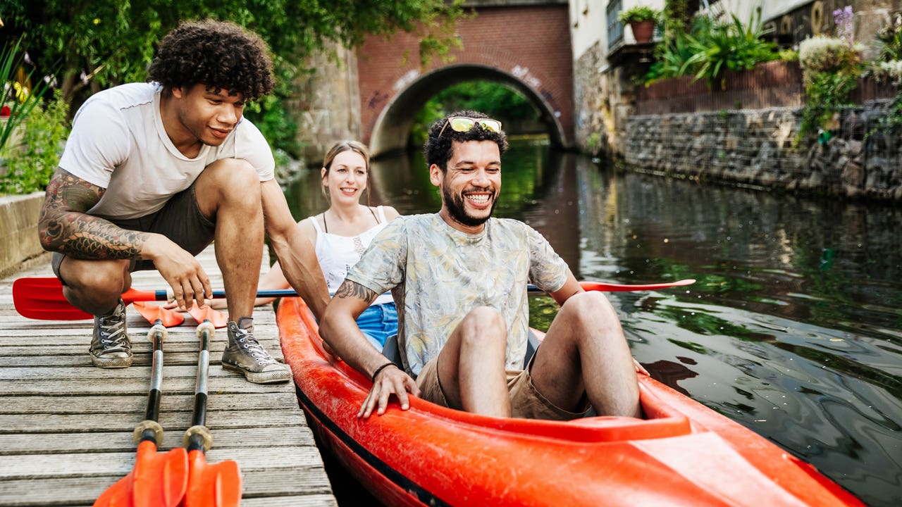 friends going kayaking on a canal