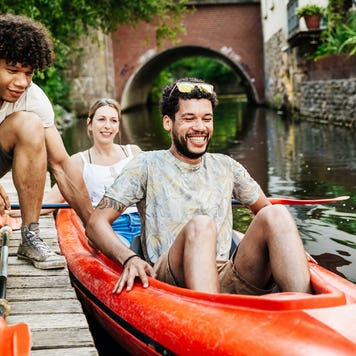 friends going kayaking on a canal