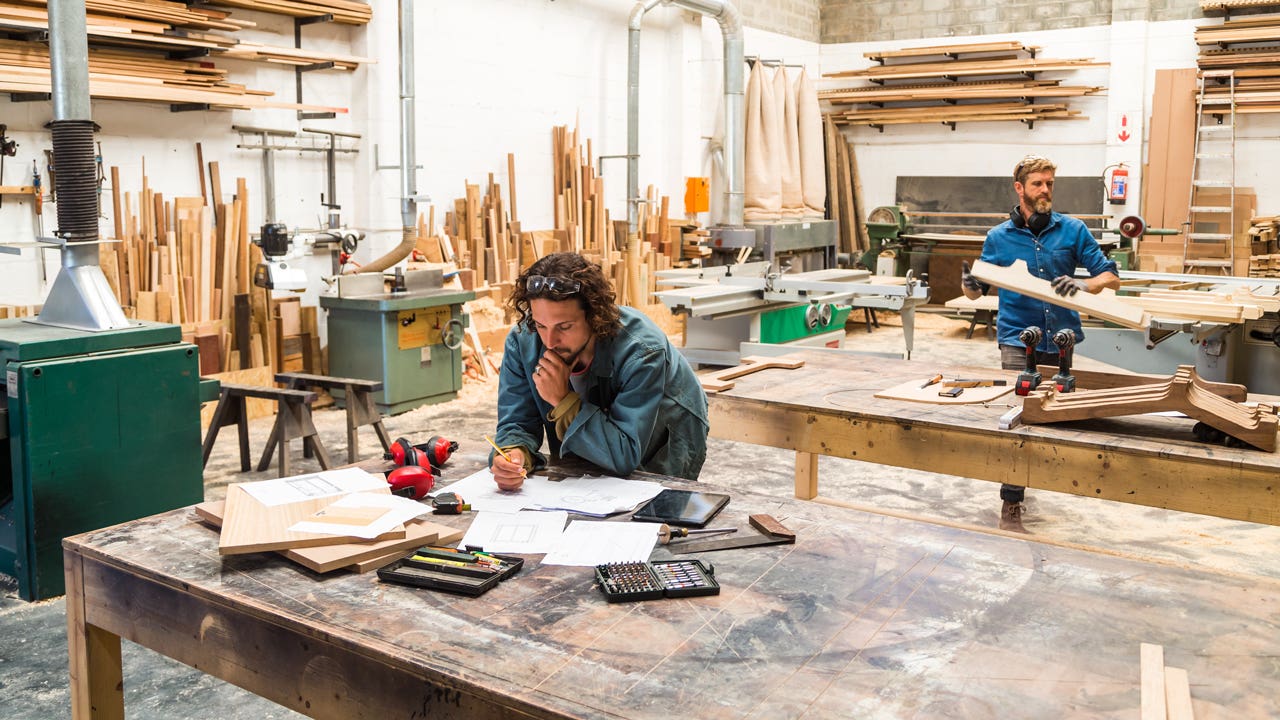 man working in furniture workshop