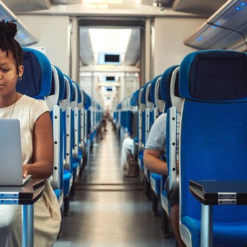 Woman riding on a passenger train