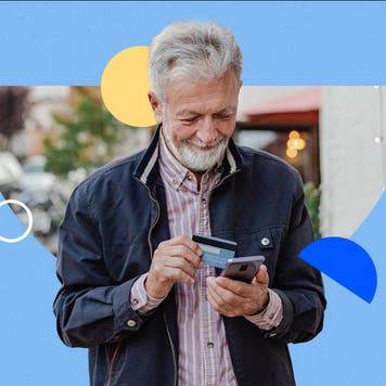 design element of a man holding a credit card and looking at his phone