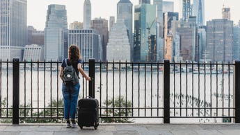 woman traveling with suitcase in new york city