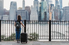 woman traveling with suitcase in new york city
