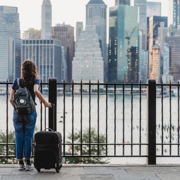 woman traveling with suitcase in new york city