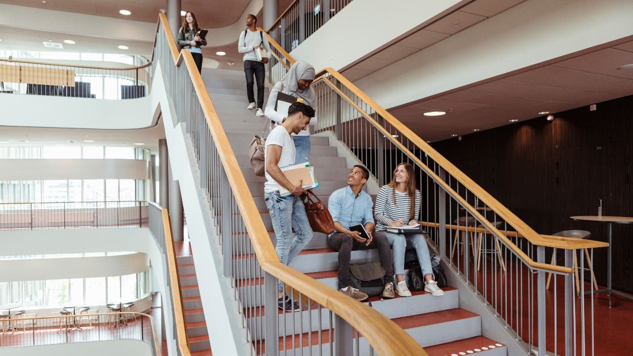 Students hang out on college stairs
