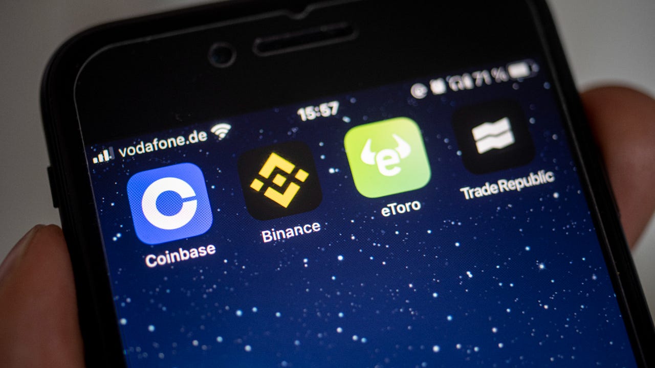 A picture of Binance and Coinbase apps on a phone