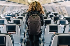Woman deboarding an airplane