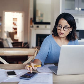 Woman works with a calculator