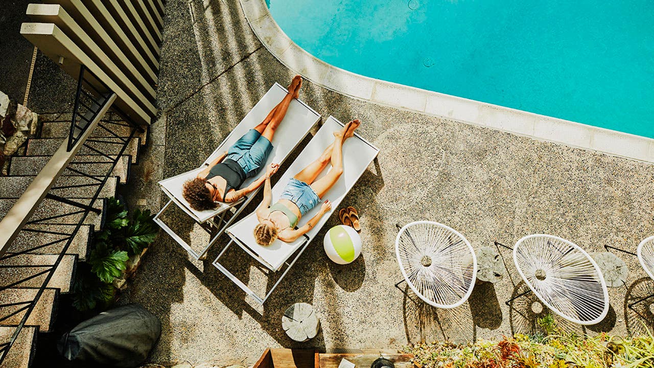 lesbian couple at a hotel pool