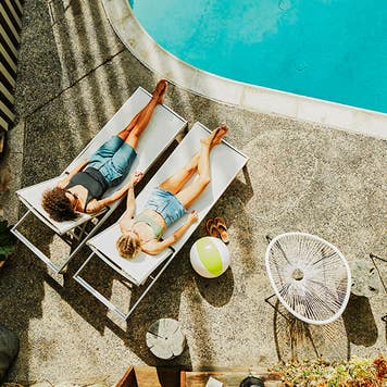 lesbian couple at a hotel pool