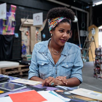 woman talking to colleague in design studio