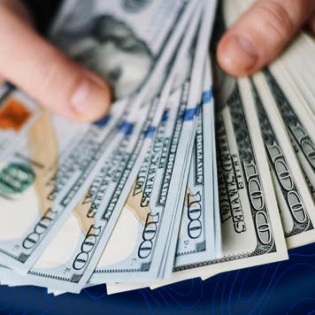 woman holding 100 dollar bills