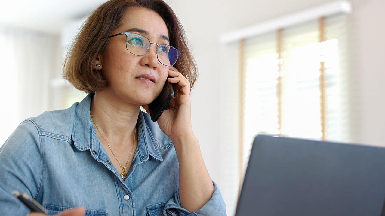 concerned woman talking on the phone