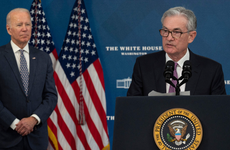 President Joe Biden stands behind Federal Reserve Chair Jerome Powell at the announcement of his renomination