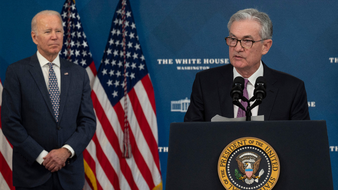 President Joe Biden stands behind Federal Reserve Chair Jerome Powell at the announcement of his renomination