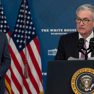 President Joe Biden stands behind Federal Reserve Chair Jerome Powell at the announcement of his renomination