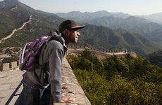 man traveling to the Great Wall of china
