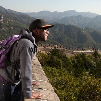 man traveling to the Great Wall of china