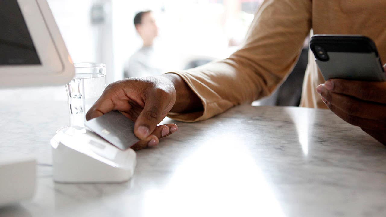 customer using tap to pay at a shop