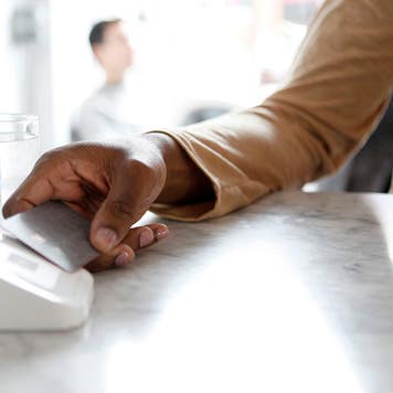 customer using tap to pay at a shop