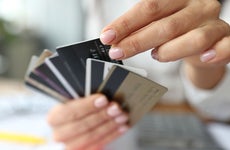 woman holding multiple credit cards