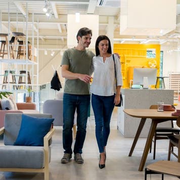 Couple looking at items in a furniture store