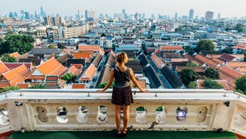 woman looking out at view of city