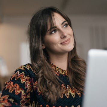 Woman at laptop smiling