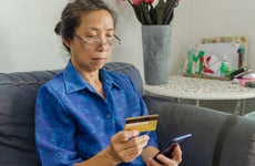 woman looking at card