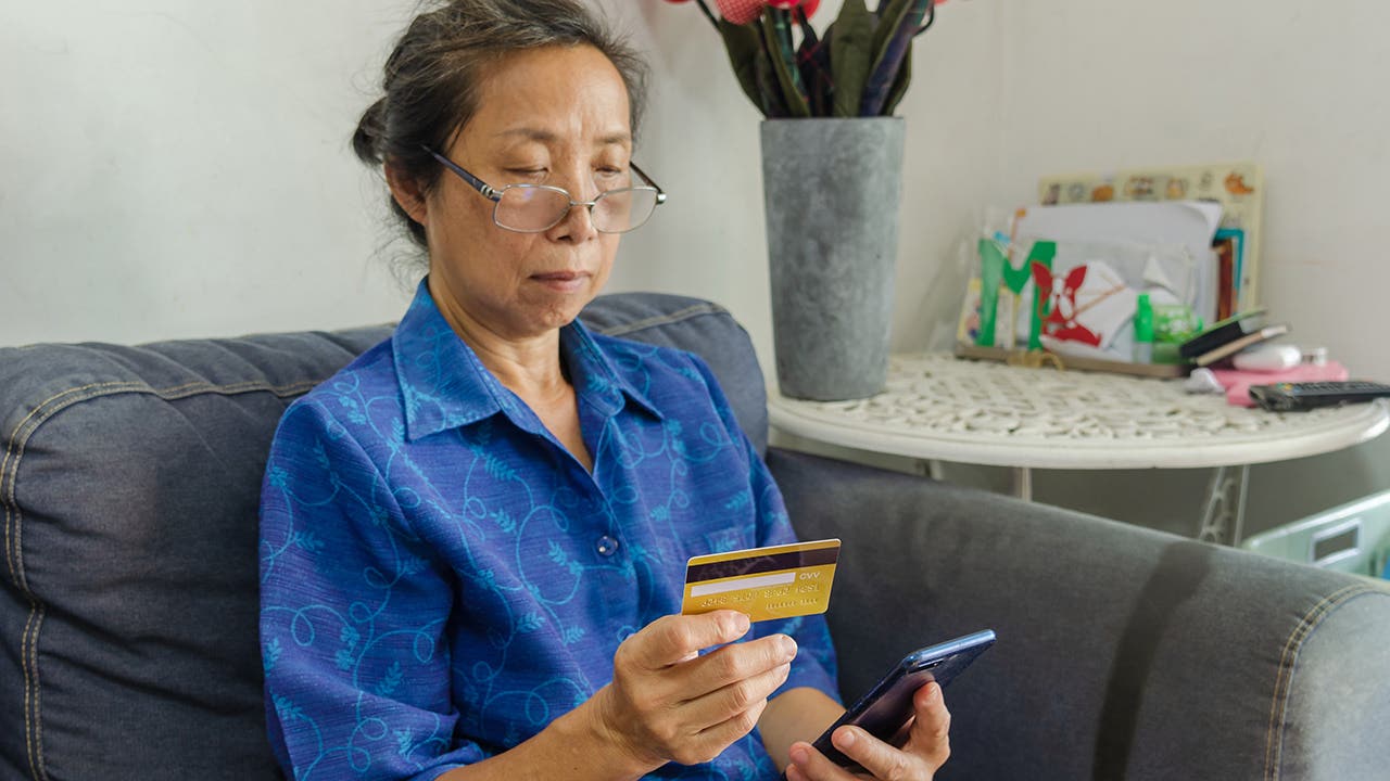 woman looking at card