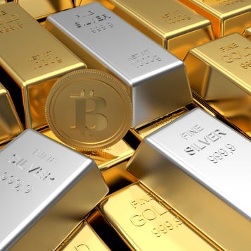 Gold and silver bars with a golden Bitcoin