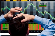 Trader looks at plummeting stock chart