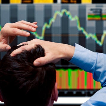Trader looks at plummeting stock chart