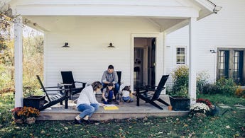 family playing together on porch