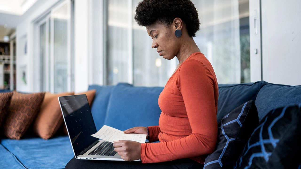 woman looking at paperwork