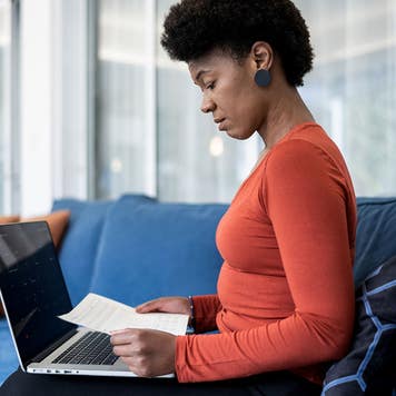 woman looking at paperwork