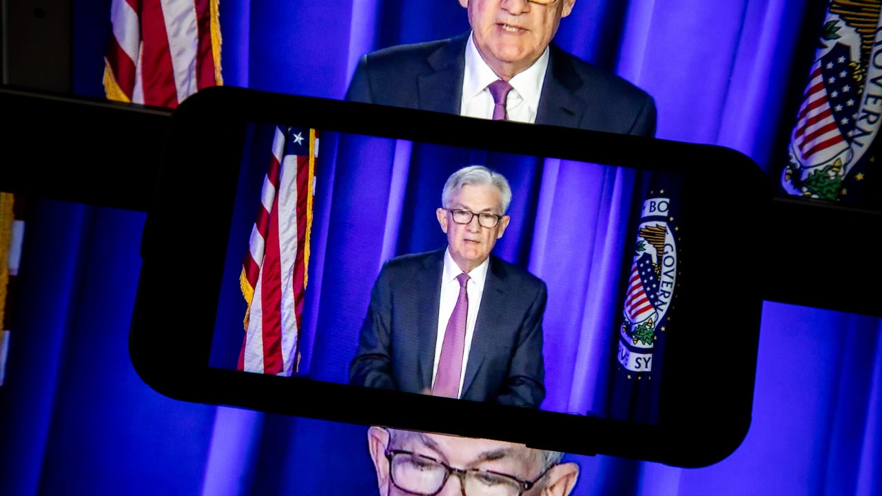 Pictures of Fed chair Jerome Powell on phones