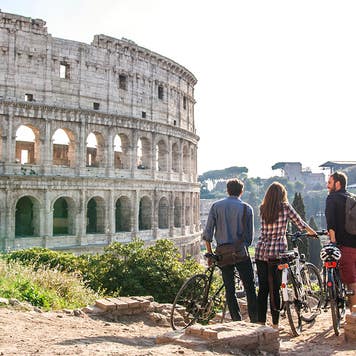 friends bicycling in rome