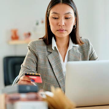 Woman using credit card for online payments