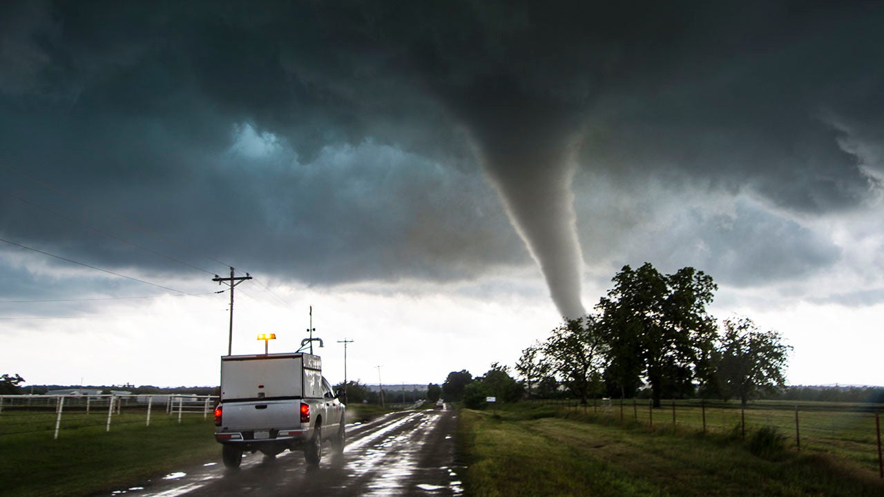 Storm vehicle with the Center for Severe Weather Research driving into the path of tornado in Katie, Oklahoma