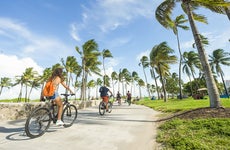 people riding bicycles in miami beach florida