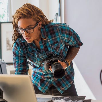 photographer checking his laptop in his studio