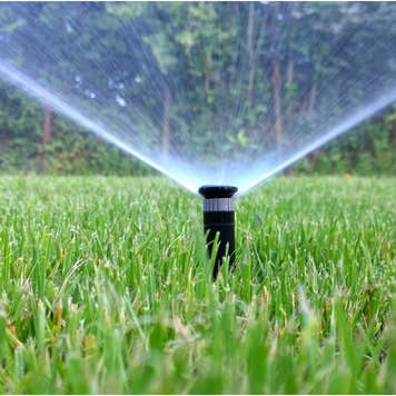 Sprinkler watering a lawn automatically