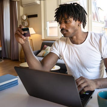 a man shopping online at home