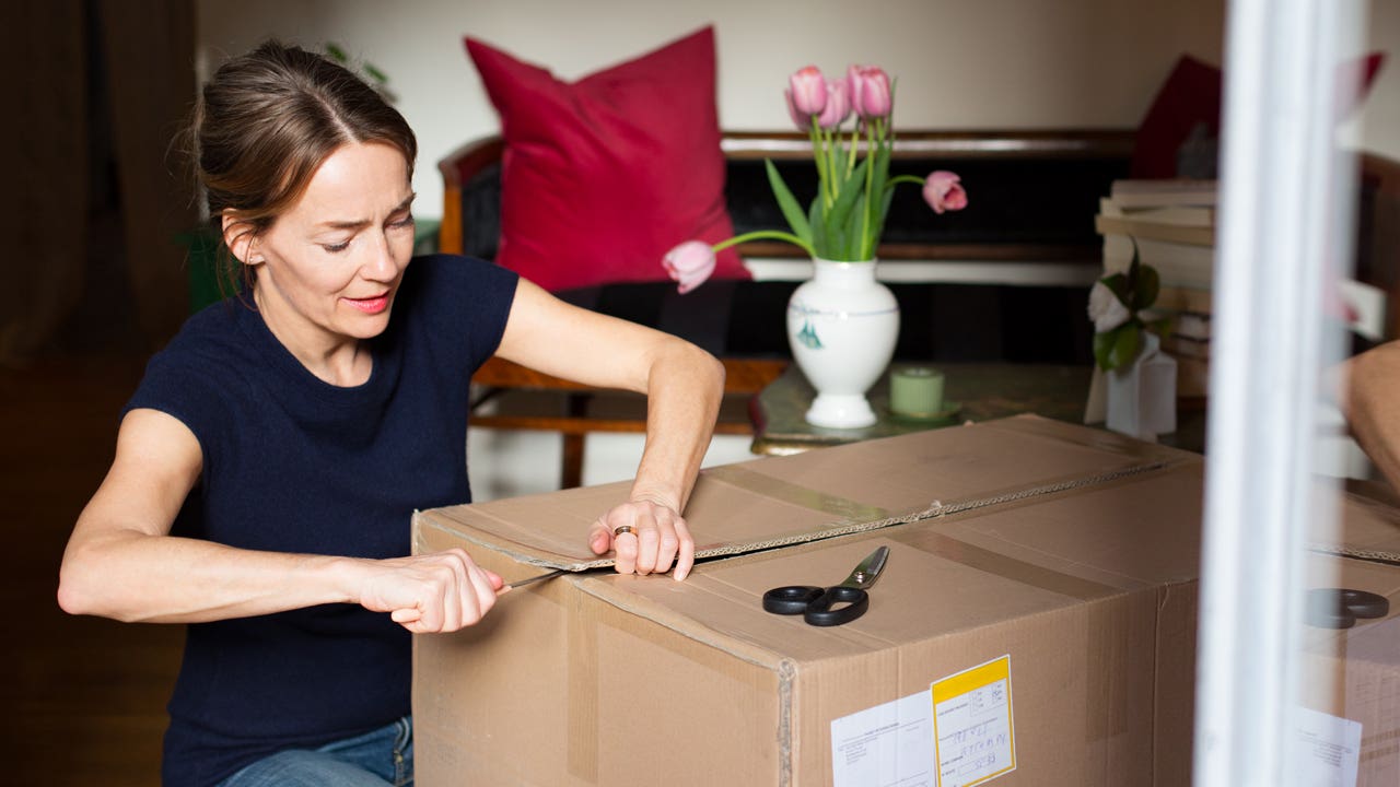 woman opening a package