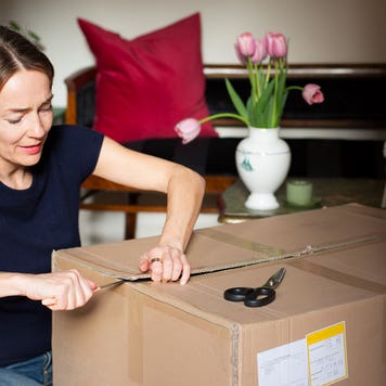 woman opening a package